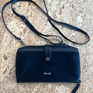 The Sak Black Crossbody Bag with Textured Fabric and Secure Closure